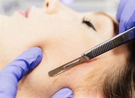 Scalpel scarping face